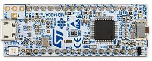 A typical microcontroller development board. The MCU is the square chip in the middle; most of the board is programming and debugging circuitry that a product would not carry.